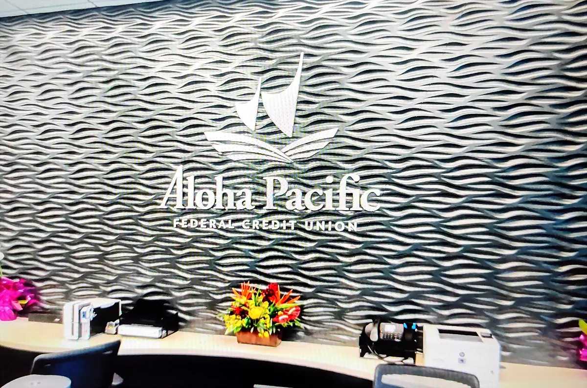 Custom feature wall and branding at the Aloha Pacific Federal Credit Union branch in Kahului, Maui