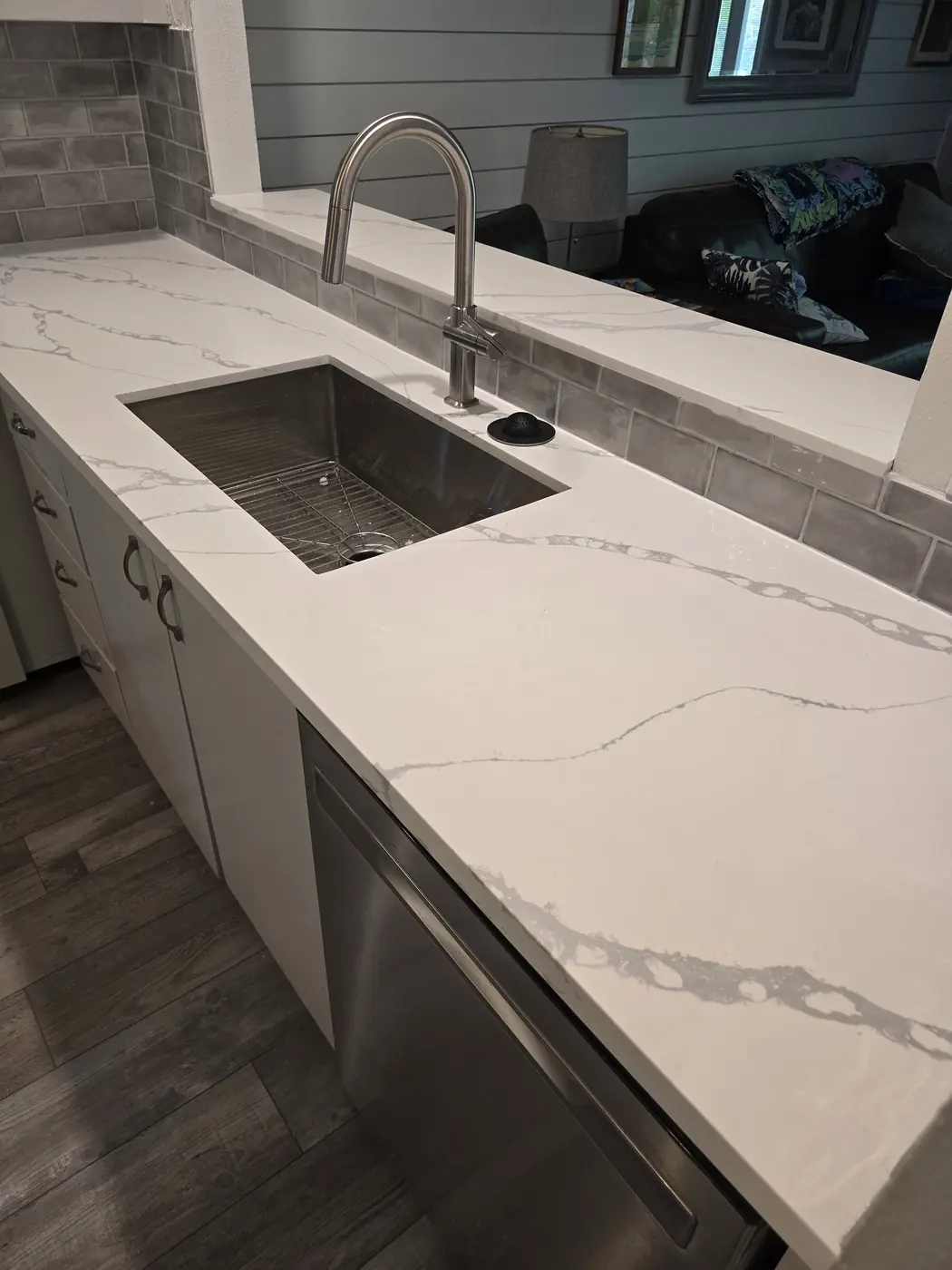 Quartz countertop installation with undermount sink in a Maui kitchen remodel by Can Can Builders