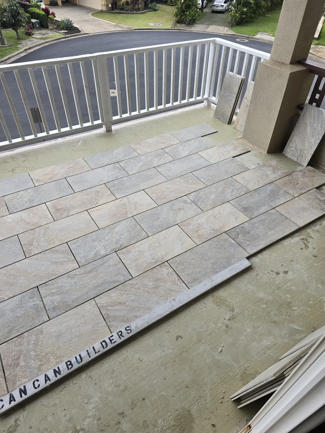 Stone-look tile installation on a Maui lanai by Can Can Builders