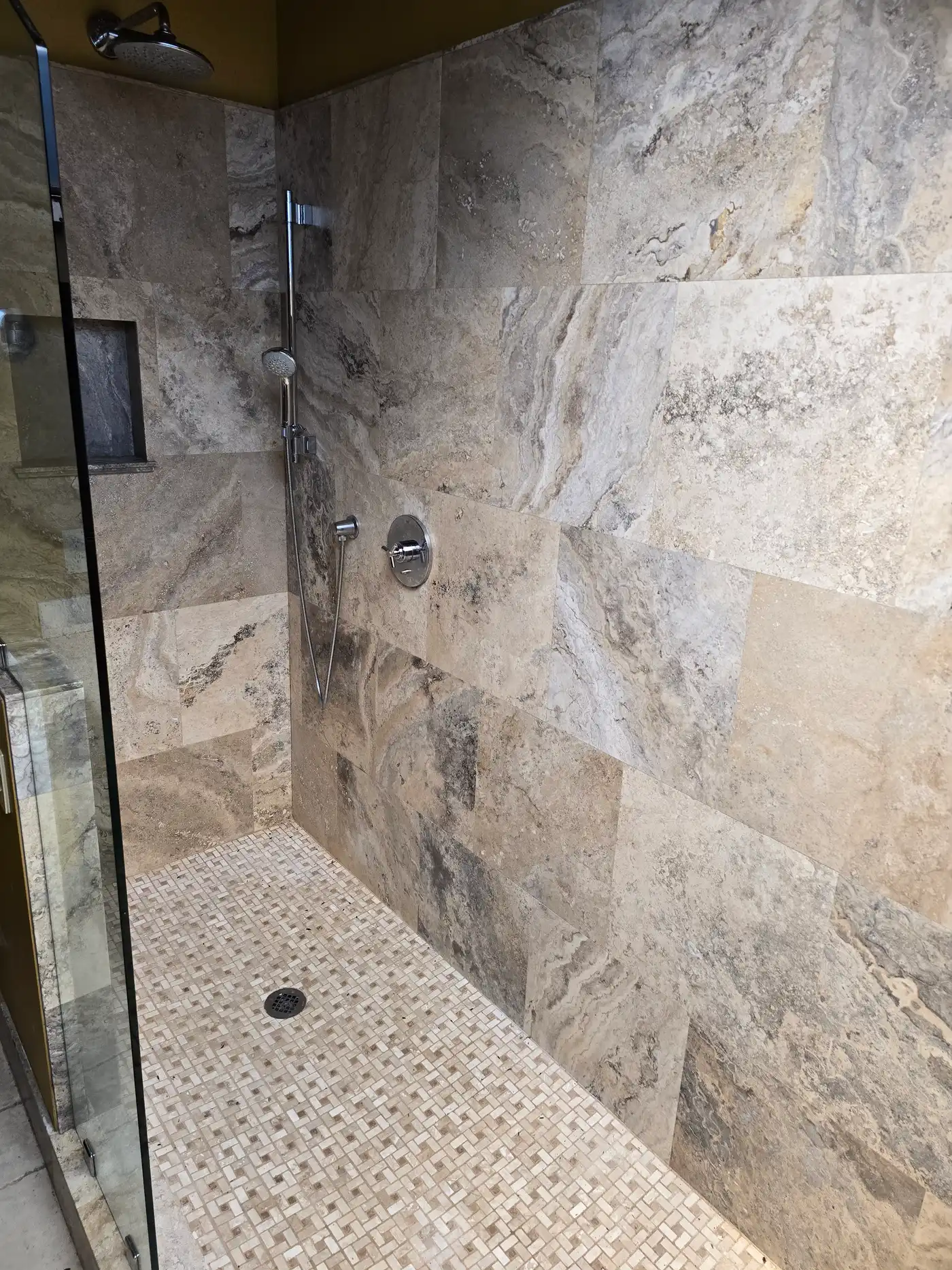 Bathroom remodeling in Maui — custom natural stone tile shower by Can Can Builders